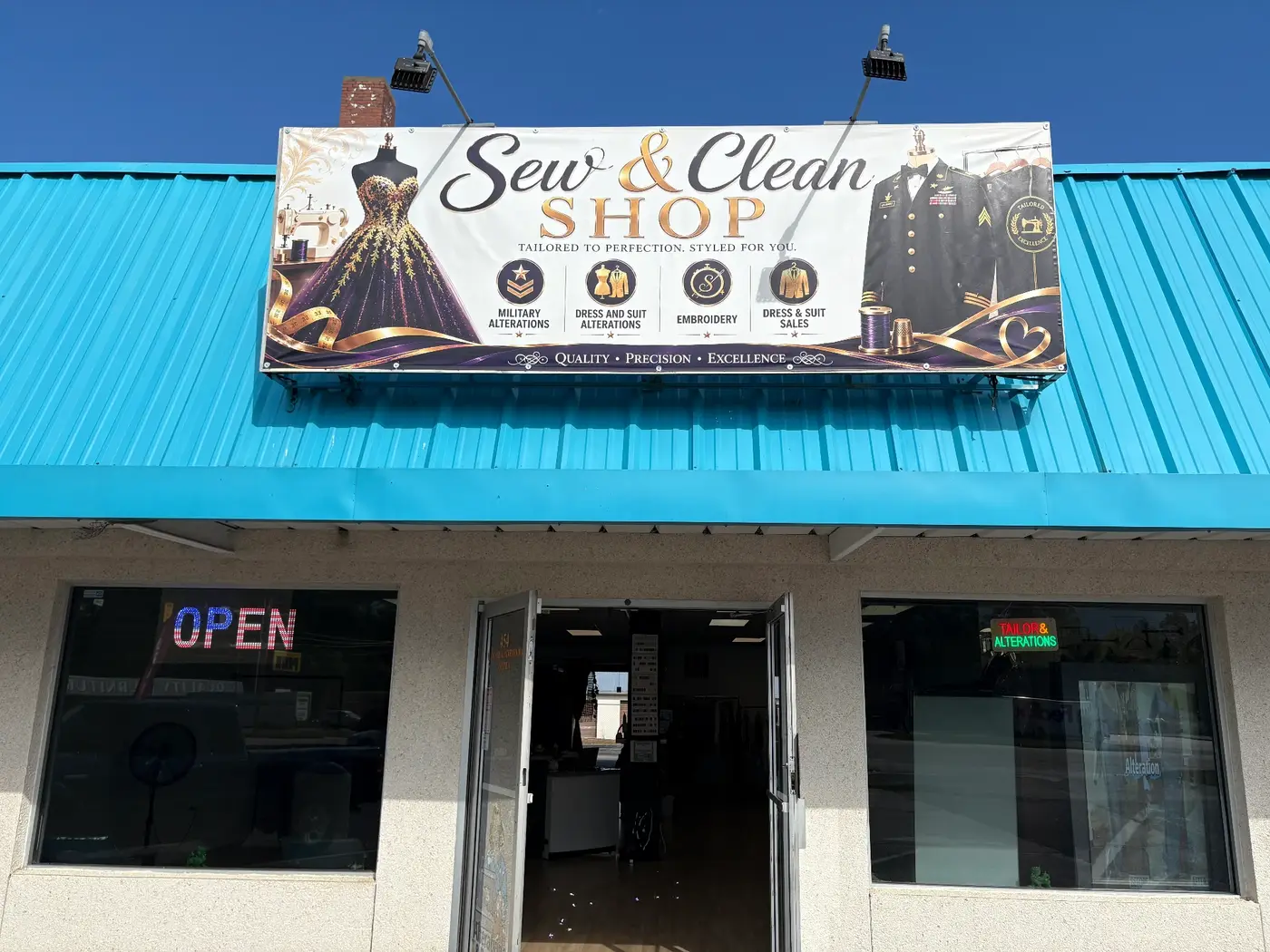Sew & Clean Shop storefront sign above the entrance in Son Bon Plaza